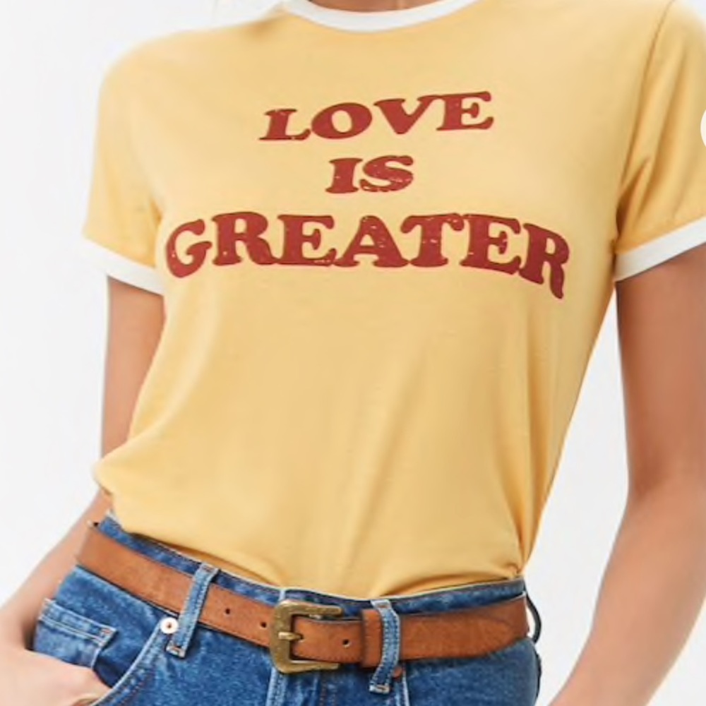 “Love is Greater” slogan tee